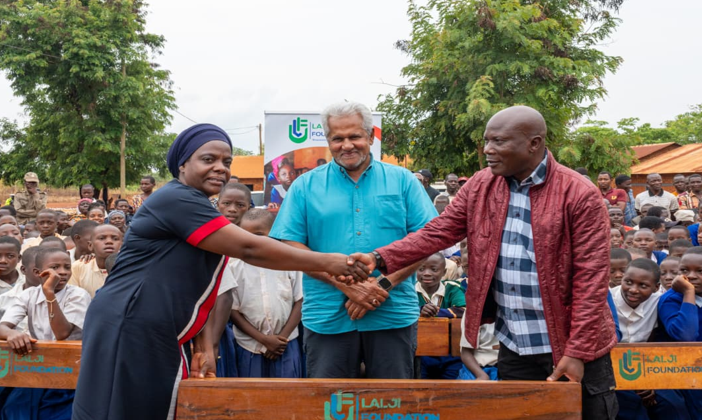 Lalji with distict comissioner and education officer at the school desks project