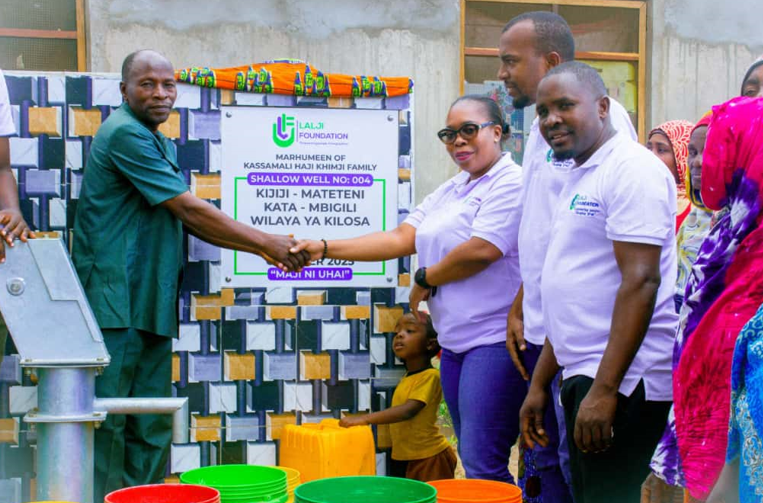 Mateteni village chairman accepting the clean water shallow well project

