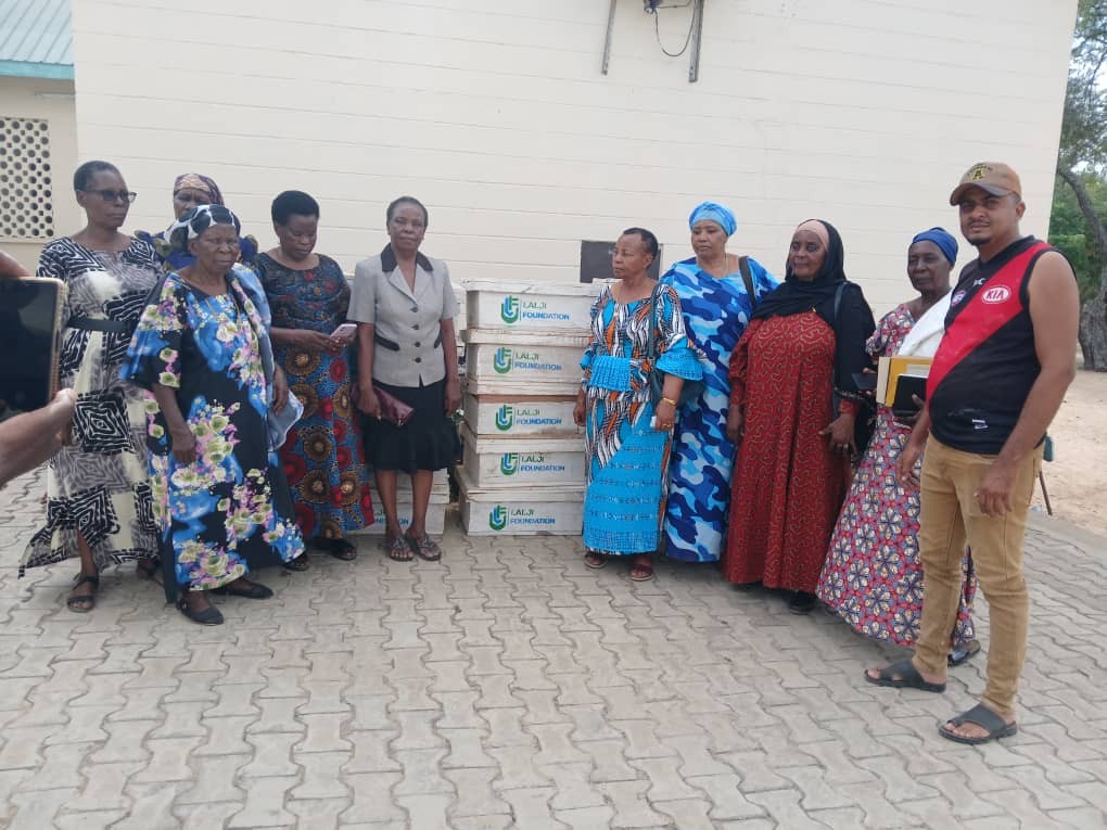 CCWWT representatives with the stack of beehives donated by Lalji foundation for the beekeeping project
